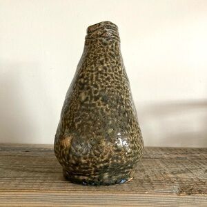 Handmade heavy pottery bottle coiled style